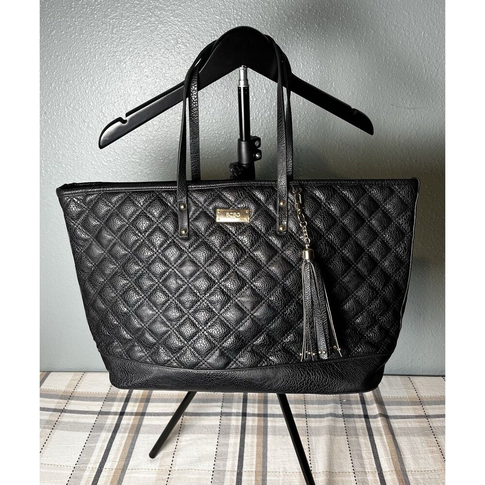 BCBG Women's Black Quilted Faux Leather Tote Bag with Tassel Accent